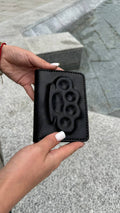 Passport cover with brass knuckles in black  image 0