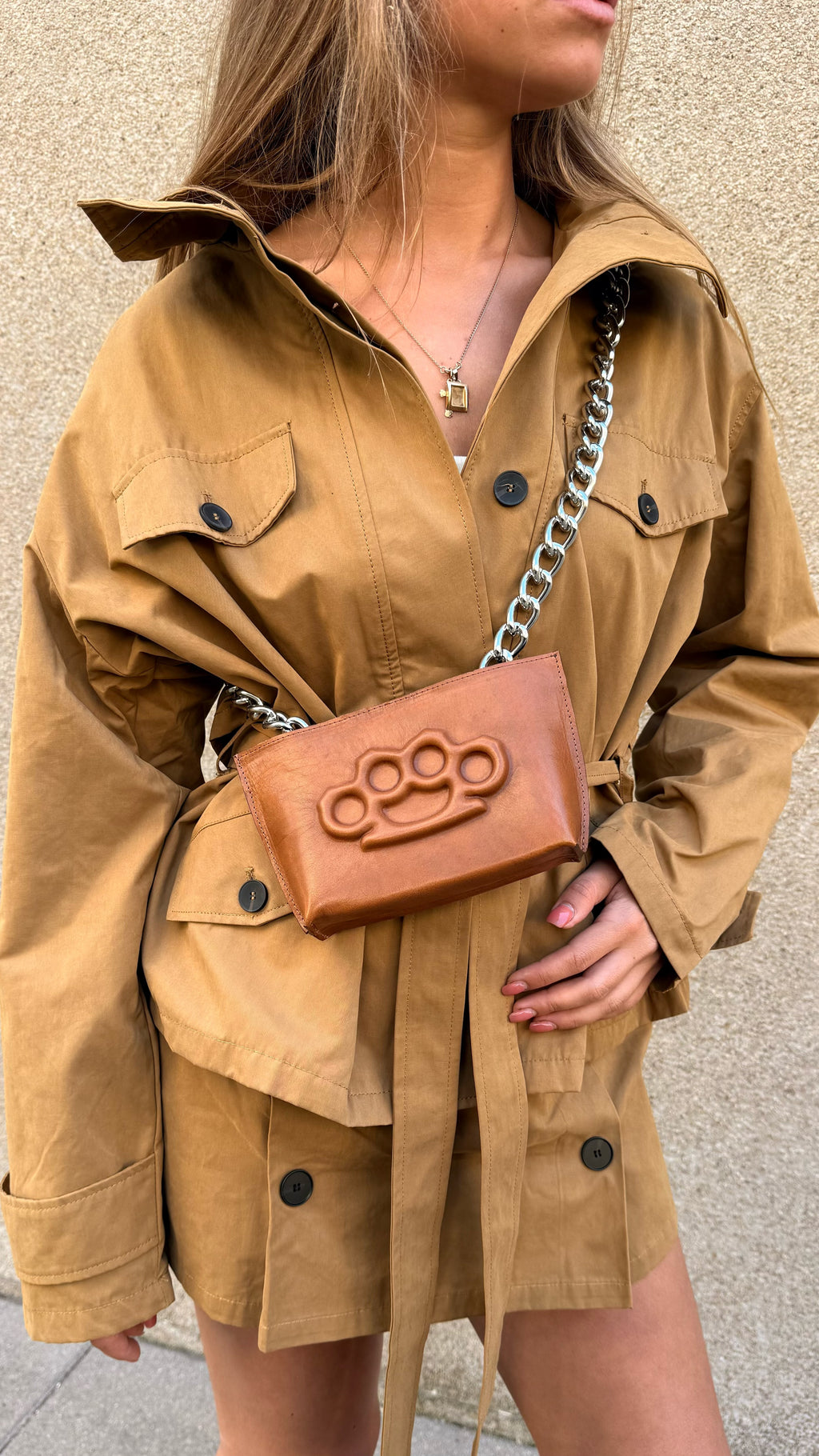 Mini bag with brass knuckles