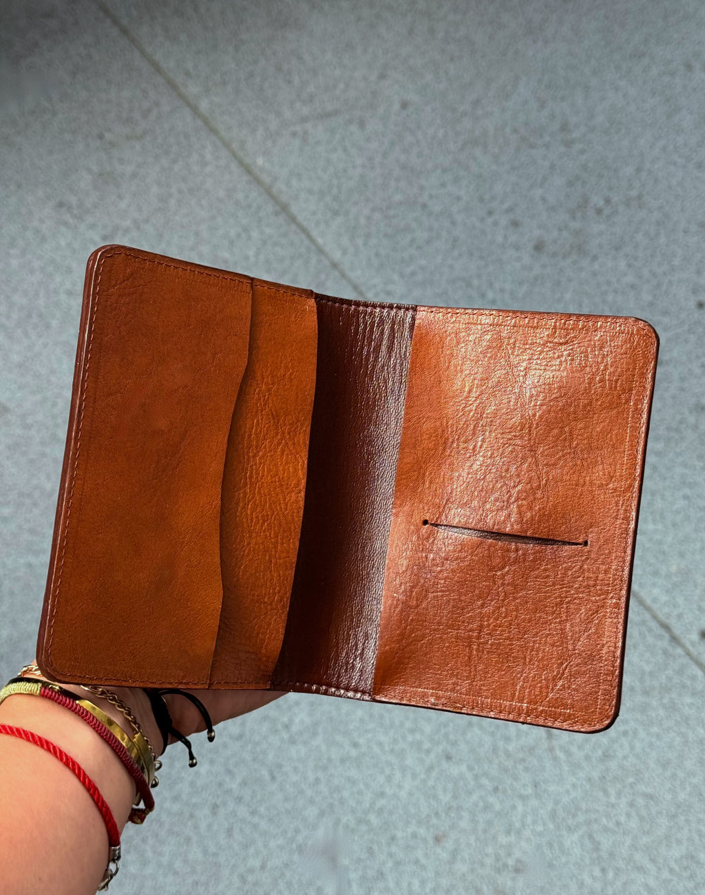 Passport cover with a brass knuckles in brown image 1